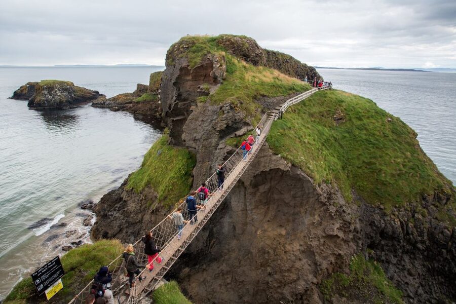 Dublin: Giant's Causeway & Glens of Antrim Day Tour - Belfast, cranes, and the change from train to coach