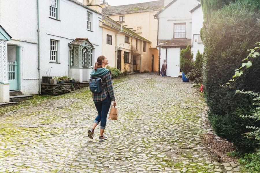 From Manchester: Lake District Bus Tour & Windermere Cruise - Coniston Water from the road