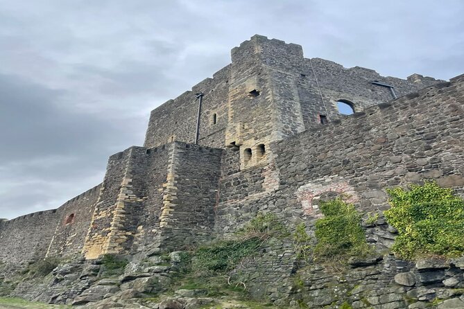Giants Causeway, Rope Bridge, Carrickfergus Castle and Dark Hedges Tour - Dunluce Castle in five minutes