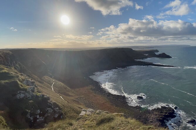 Giants Causeway Tour from Belfast + FREE Belfast Mural Tour - Dunluce Castle: a short stop with a dramatic setting