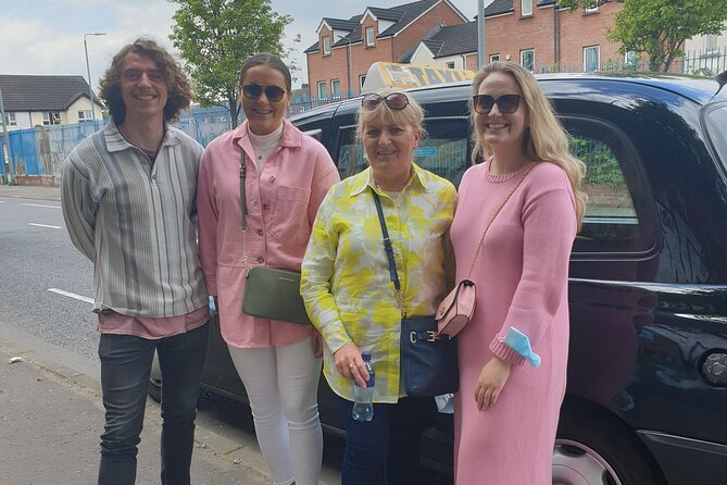 Iconic Belfast Black Cab Tour - Standing at the Peace Wall