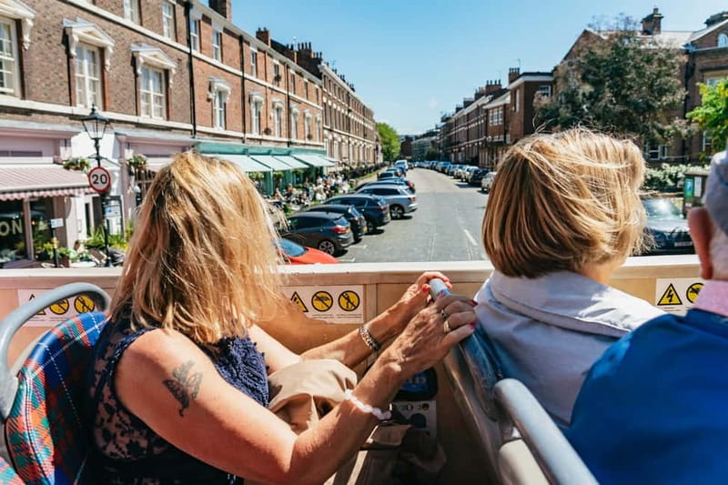 Liverpool: City & Beatles Tour with Live Guide & Live Music - Live music, jokes, and local storytelling