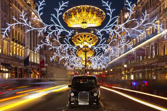 London by Night Bus Tour with Christmas Lights and Live Guide - The Strand and the fairy lights near the Savoy