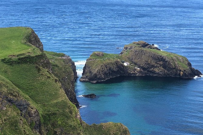 Private Giants Causeway & Antrim Coast Tour - Dunluce Castle above the sea